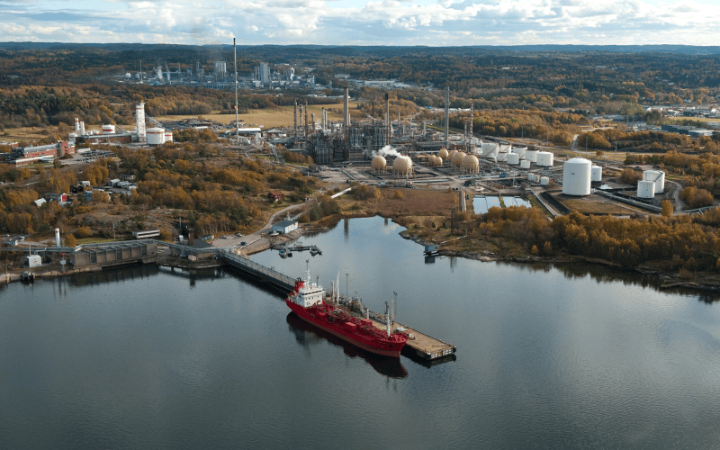 Aerial view of the Borealis cracker plant in Stenungsund, Sweden, showing process towers, pipe racks, and coastal industrial infrastructure.